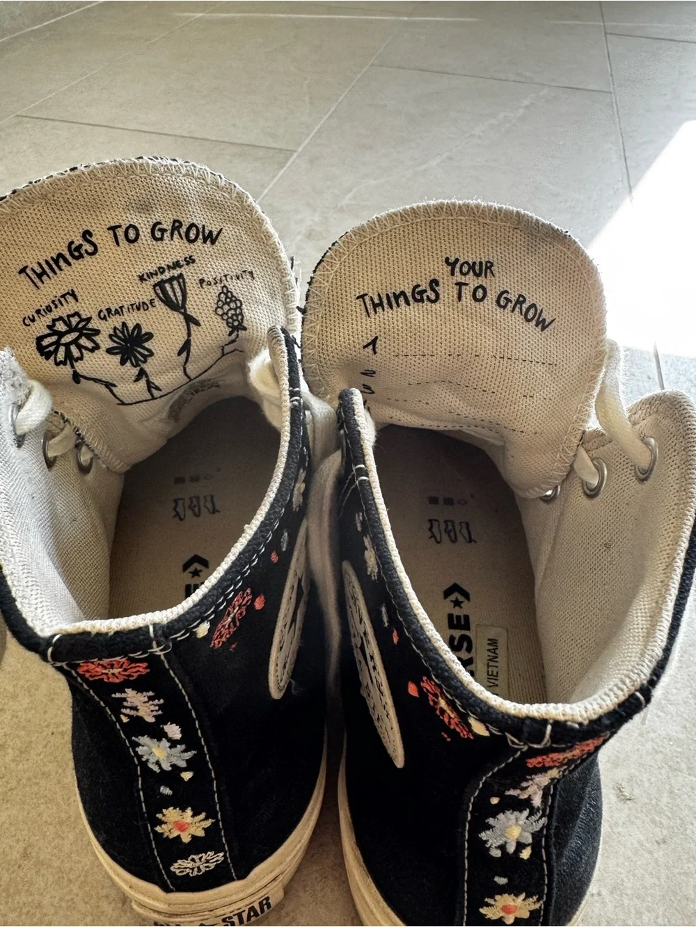 Black High-Top Canvas Sneakers with White Laces and Subtle Floral Embroidery